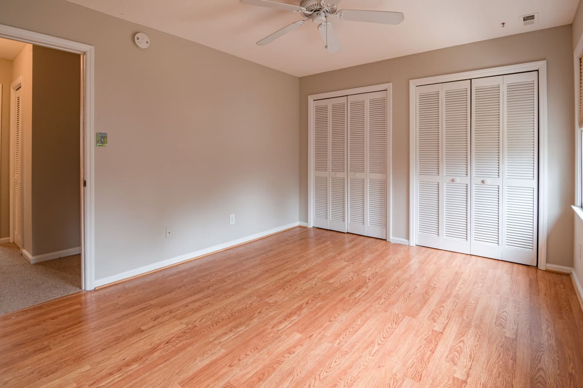 Room with bifold closet doors hung square in the opening