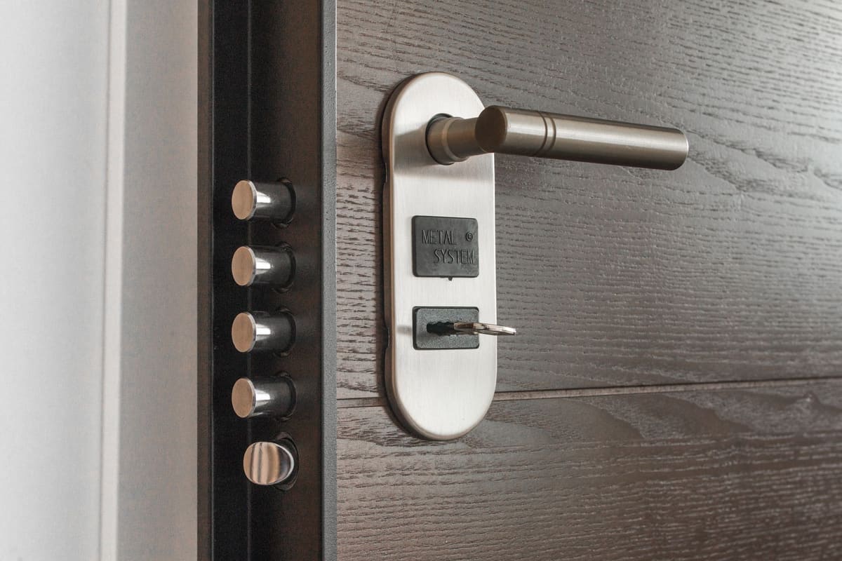 Deadbolt lock with a key in the cylinder on an entry door