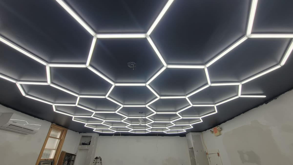 Hexagon LED grid laid out square to the room and wired back to a single switch.