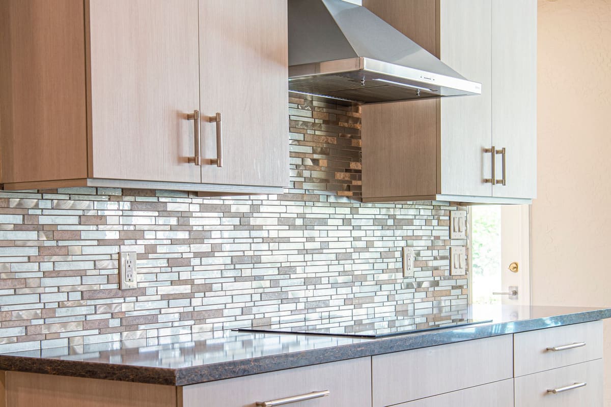 Kitchen counter with a tiled backsplash run behind it