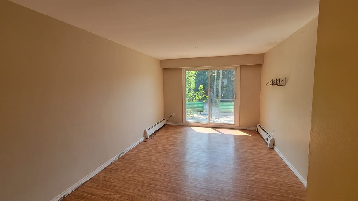 Walls filled, sanded and repainted, laminate laid and the baseboard run back in.